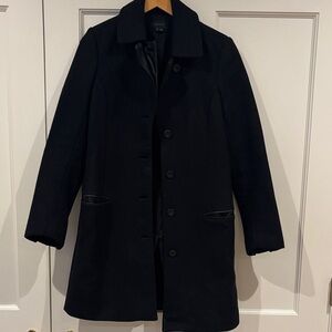 Women’s black peacoat with leather accents